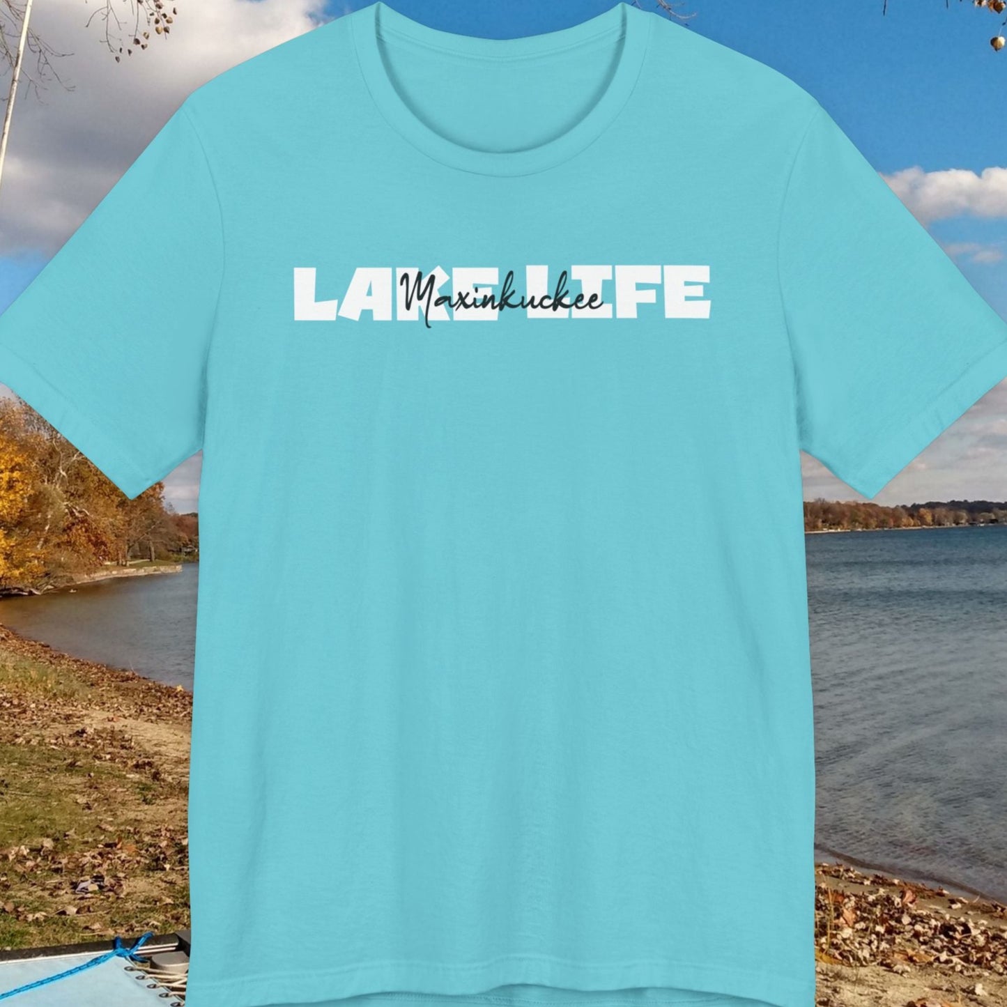Blue t-shirt with 'Lake Life' text over a scenic lake background
