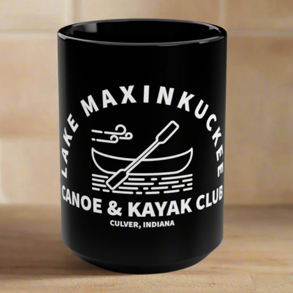 graphic of a canoe and paddle with text Lake Maxinkuckee Canoe & Kayak Club, Culver Indiana