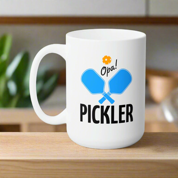 graphic of two pickleball paddles crossed with text OPA! above and PICKLER underneath