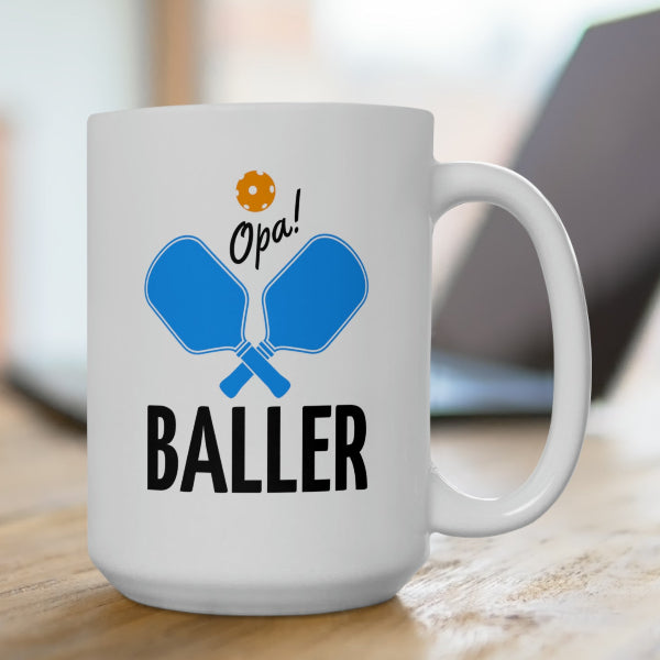 graphic of two pickleball paddles crossed with text OPA! above and BALLER underneath