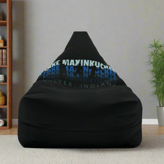 graphic Lake Maxinkuckee repeated 4 times horizontally from light blue to dark blue with Culver Indiana under that and an overlay of 3 jumping people in silhouette form