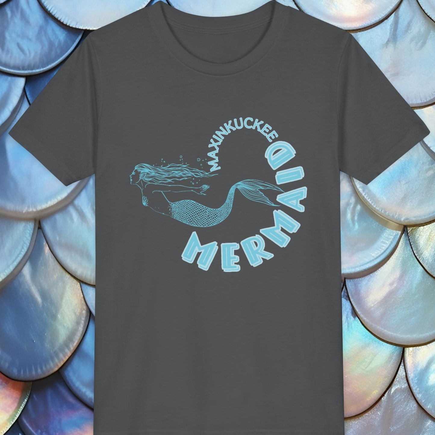  t-shirt with 'Maxinkuckee Mermaid' design on a background of blue and silver fish scales.