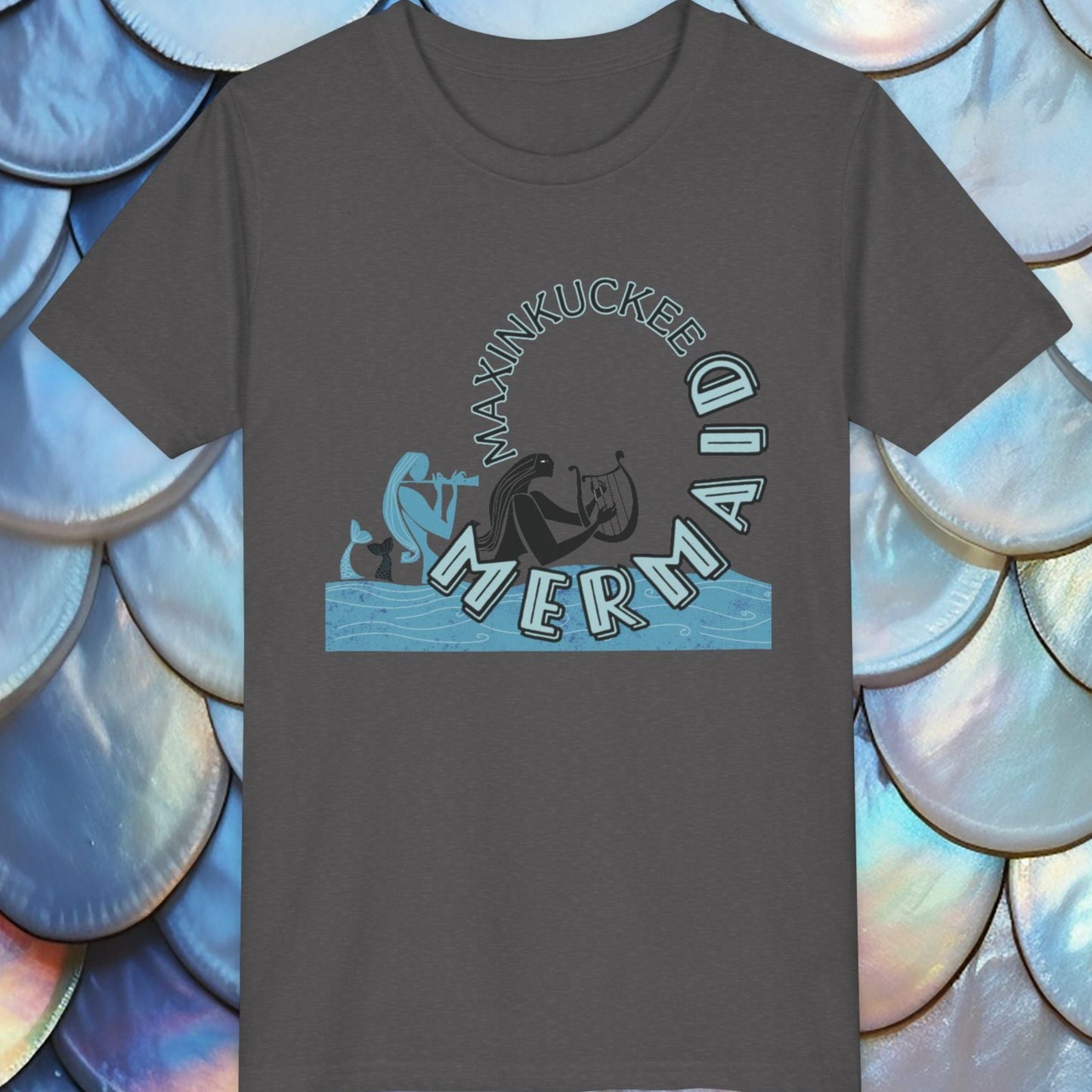  t-shirt with 'Maxinkuckee Mermaid' design on a background of blue and white shell patterns