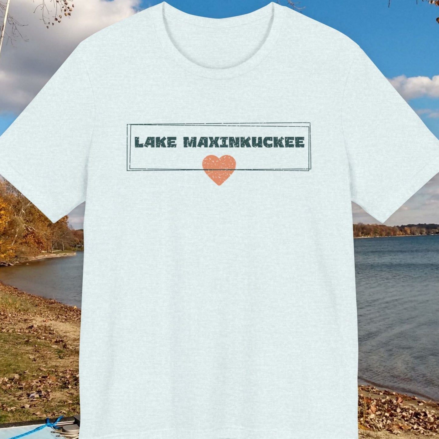 White t-shirt with 'Lake Maxinkuckee' text and heart graphic on a lake background