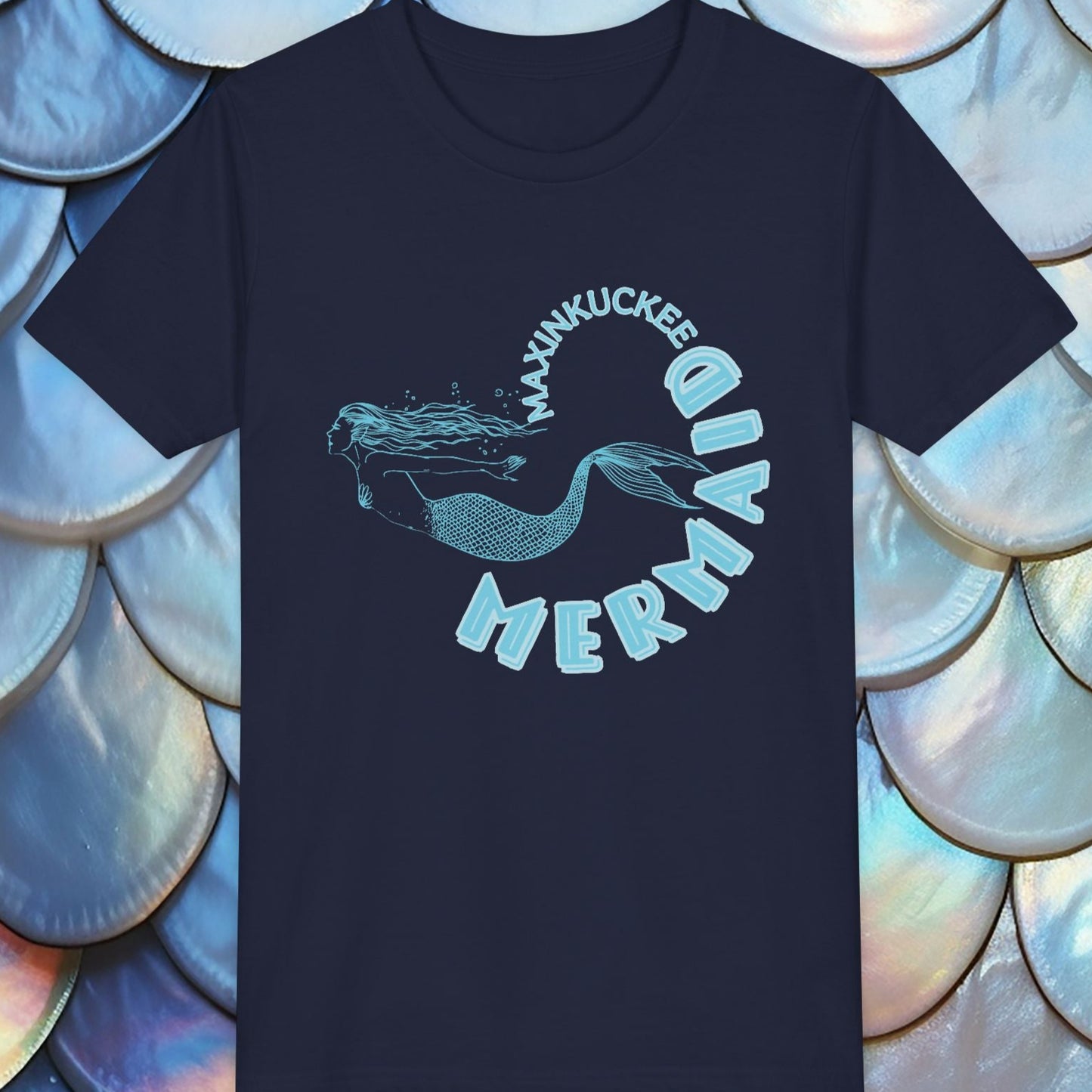  t-shirt with 'Maxinkuckee Mermaid' design on a background of blue and silver fish scales.