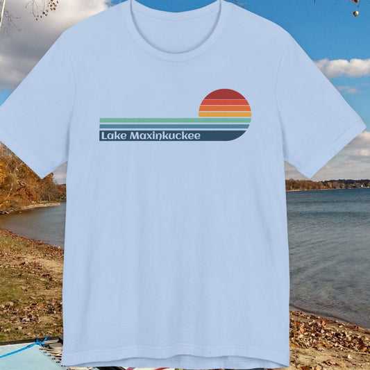 Light blue t-shirt with 'Lake Maxinkuckee' design on a scenic background