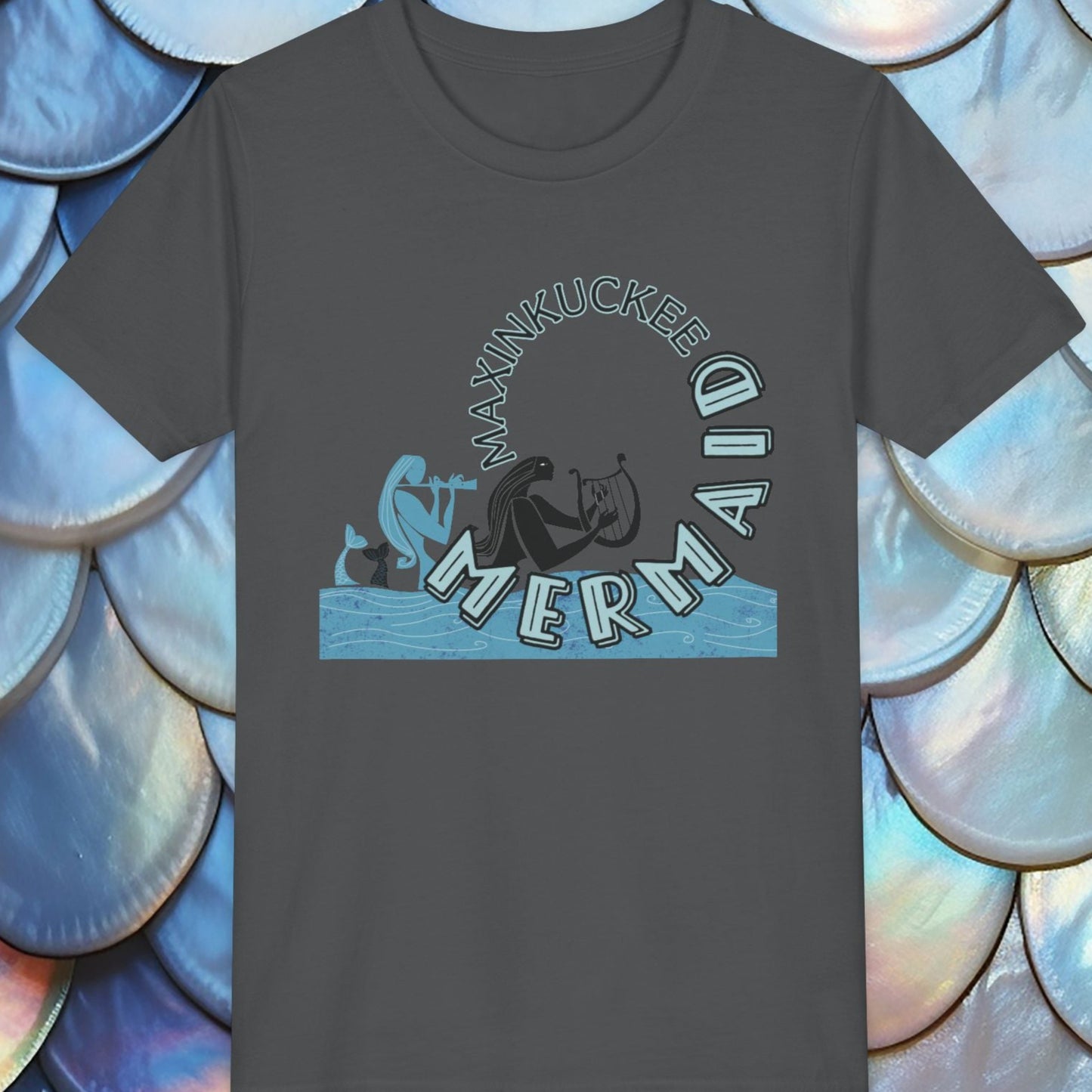 Black t-shirt with 'Maxinkuckee Mermaid' design on a background of blue and white shell patterns